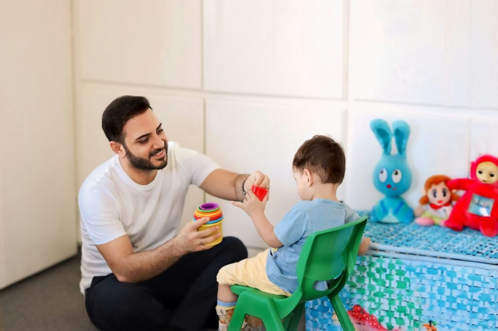 Therapist playing with a child during a child development therapy session