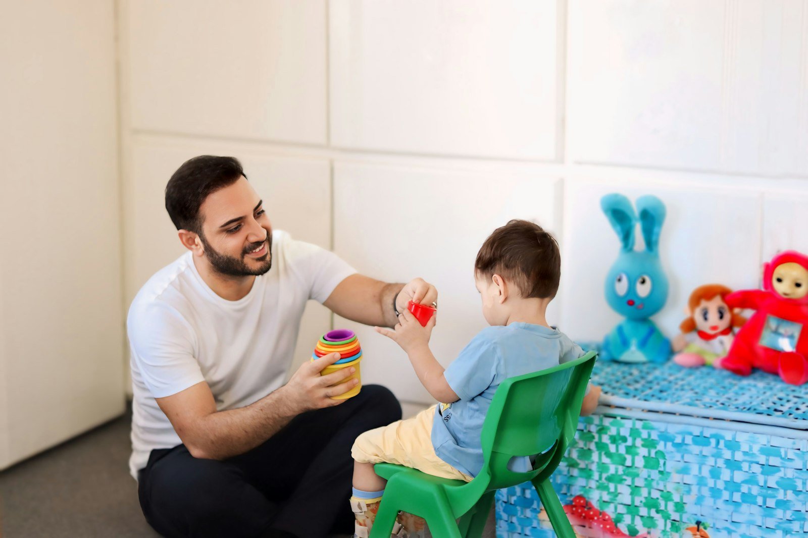 Therapist playing with a child during a child development therapy session
