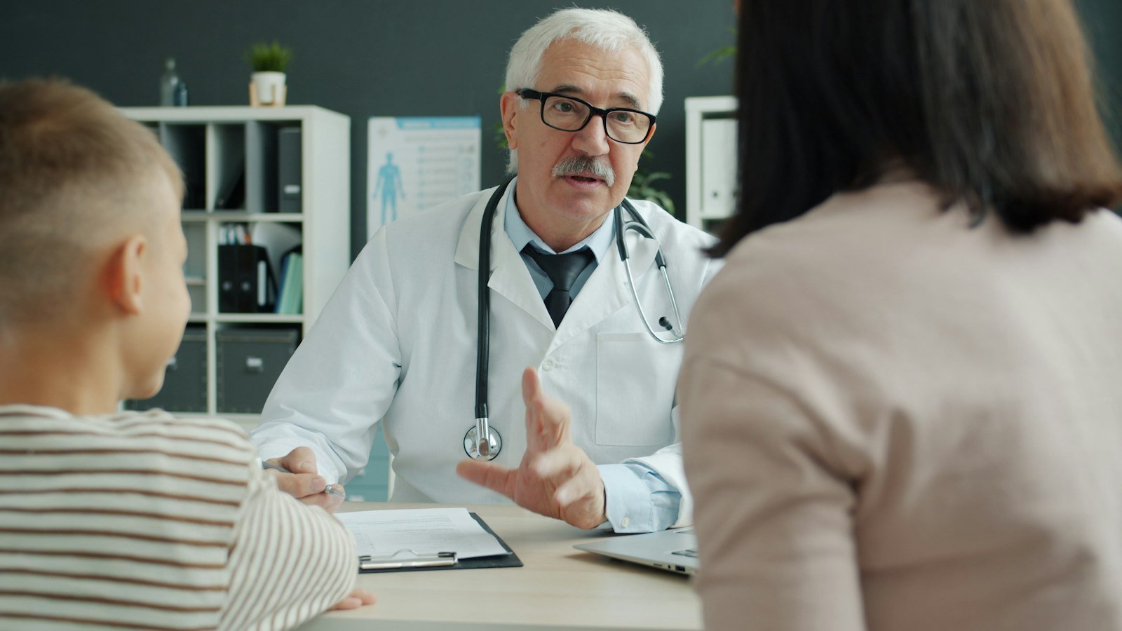 Doctor consulting a mother and child at Carewhizz medical specialties clinic