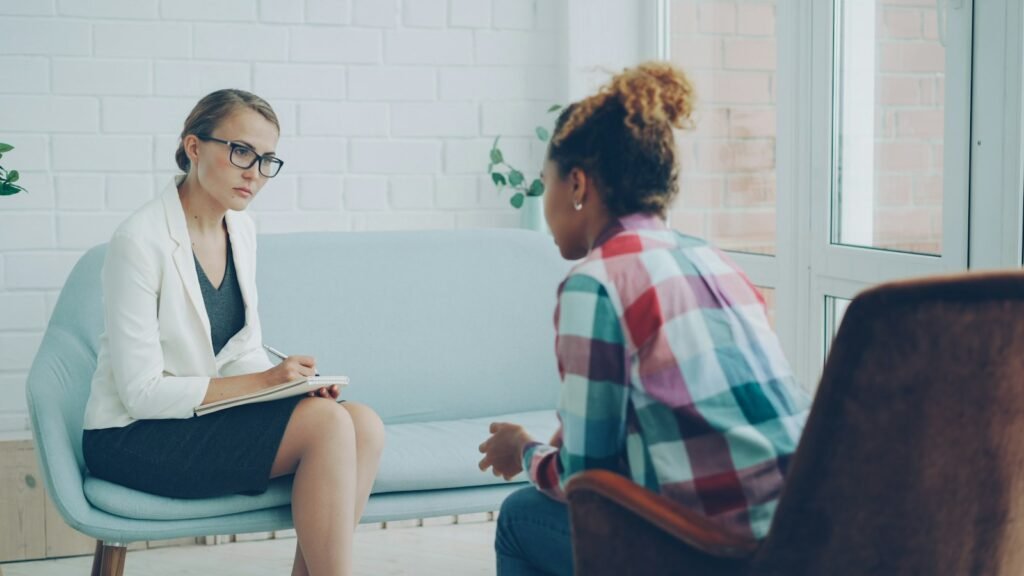 Therapist listening to a client in a counselling session